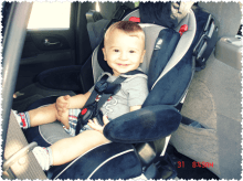 Child safely secured in car seat