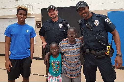 Police Officers posing with kids